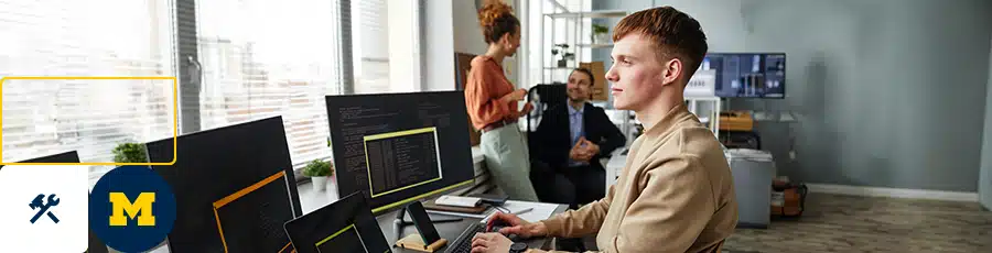 A compTIA security plus is typing on his computer 