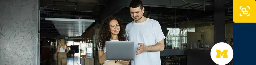 Two people are talking while looking into the computer screen - about What Does the CEH Certification Cover